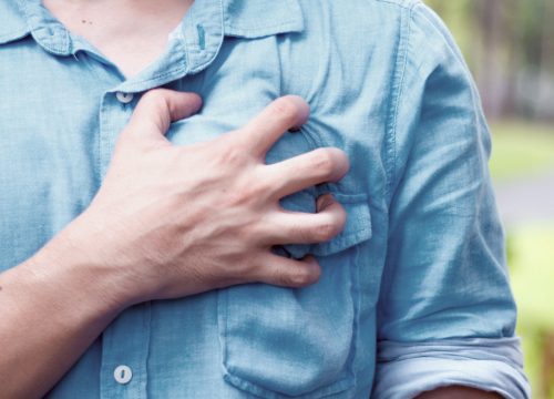 Person experiencing chest pain