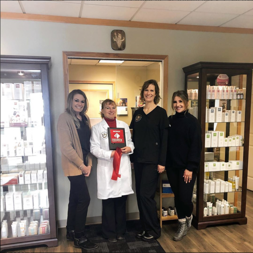 Photo of Dr. Daniela Gerard and her staff at a ribbon cutting ceremony.